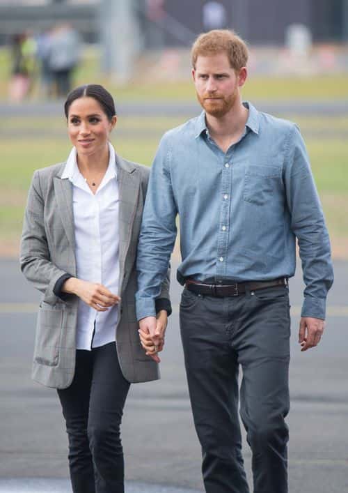 Meghan, Duchess of Sussex and Prince Harry, Duke of Sussex attend a naming and unveiling ceremony for the new Royal Flying Doctor Service aircraft at Dubbo Airport on October 17, 2018 in Dubbo, Australia. The Duke and Duchess of Sussex are on their official 16-day Autumn tour visiting cities in Australia, Fiji, Tonga and New Zealand. (Photo by Dominic Lipinski - Pool/Getty Images)