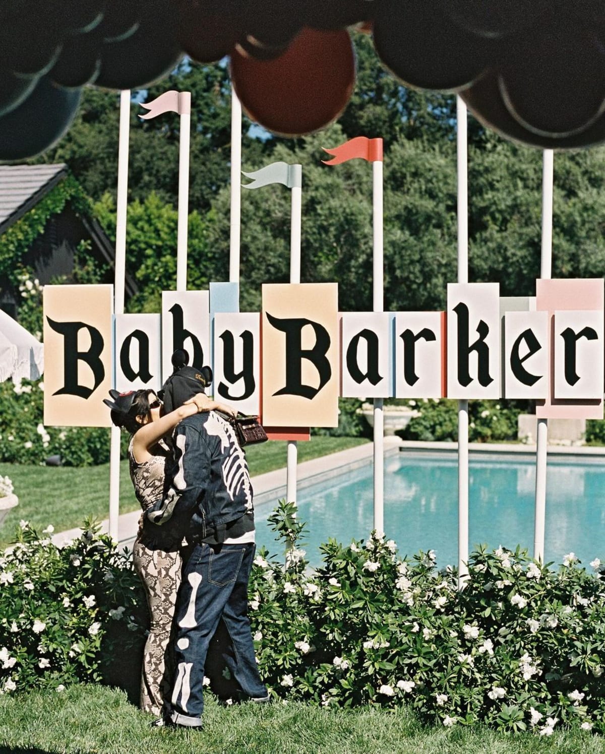 'The Kardashians' stars Kourtney Kardashian and Travis Barker at their Disney-themed baby shower (Instagram/kimkardashian)