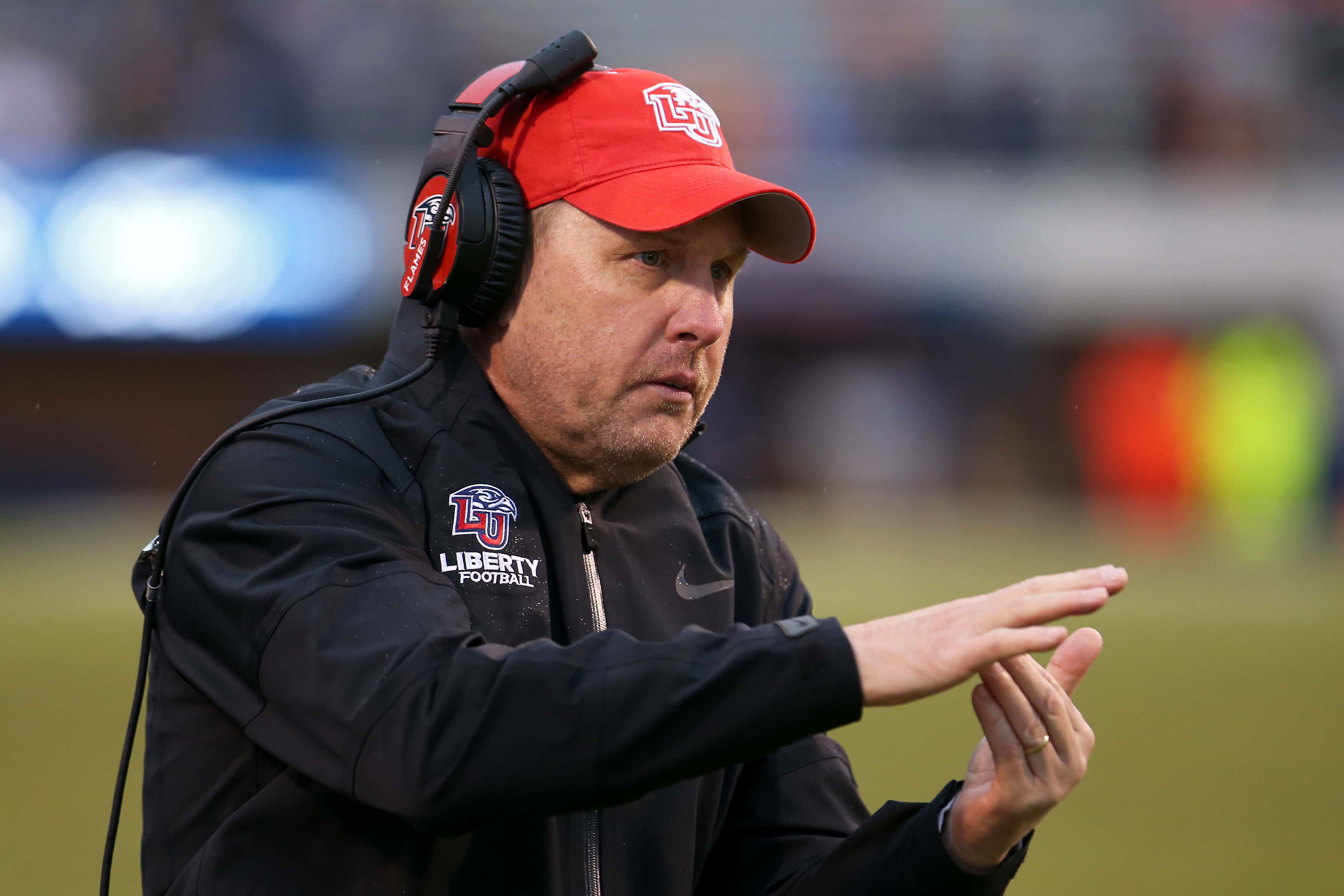 Head coach Hugh Freeze of the Liberty Flames calls a timeout in the second half during a game against the Virginia Cavaliers at Scott Stadium on November 23, 2019 in Charlottesville, Virginia.