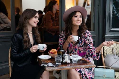Lily Collins (Emily) and Ashley Park (Mindy Chen) in 'Emily In Paris' (Netflix)