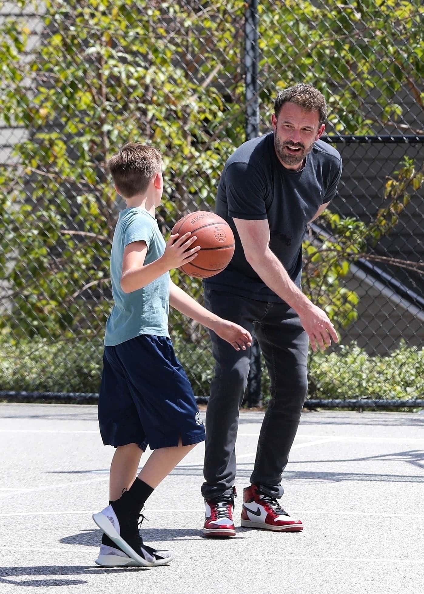 The 50-year-old ‘Justice League star opted for a casual yet sporty look to show off his hooping skills during father and son outing. (Backgrid)