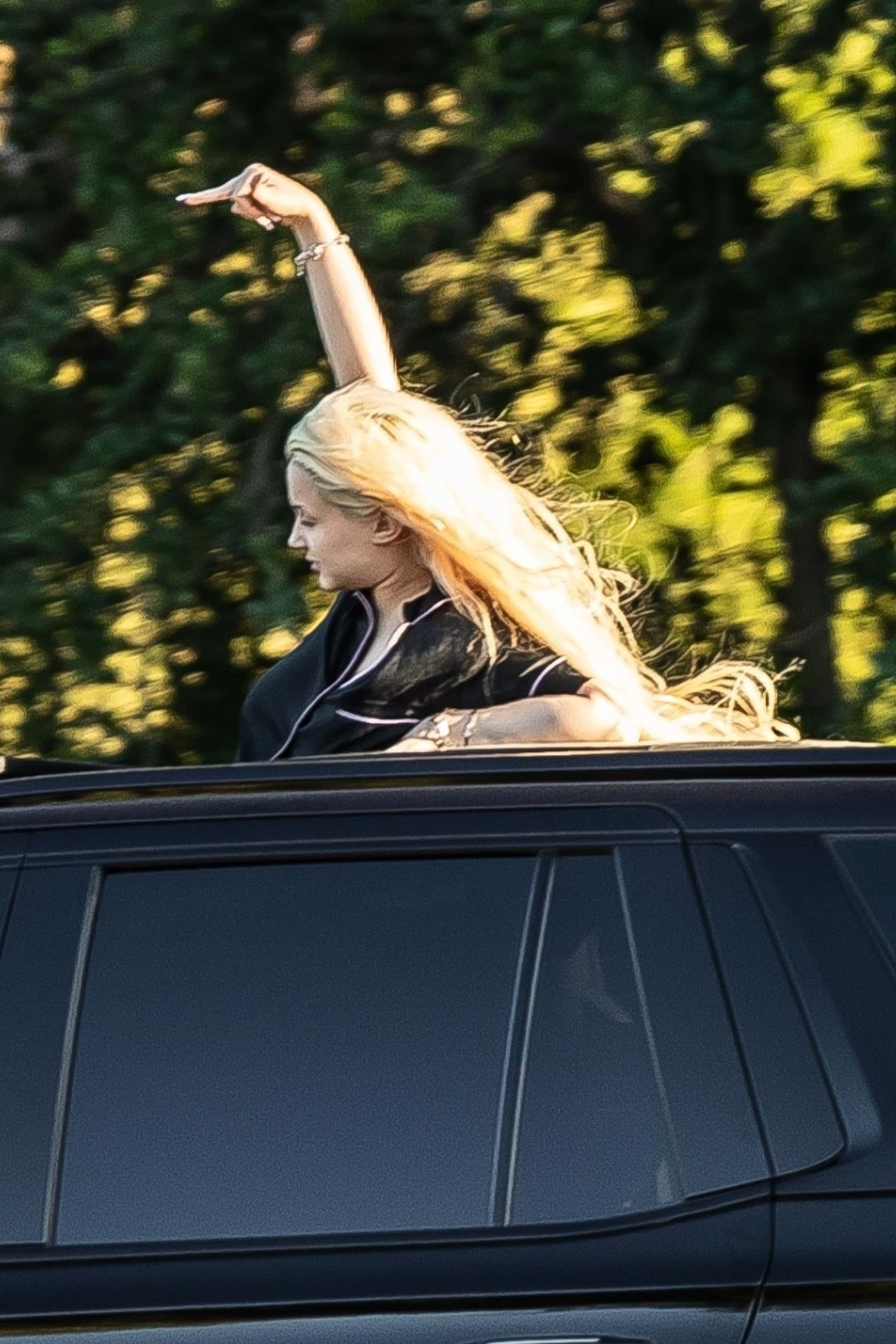 In a moment of rebellious flair, the homeschooled 17-year-old, bearing the iconic name of Patricia Arquette's True Romance character, playfully raised her right middle finger in the air, seemingly directed at no specific target (Backgrid)