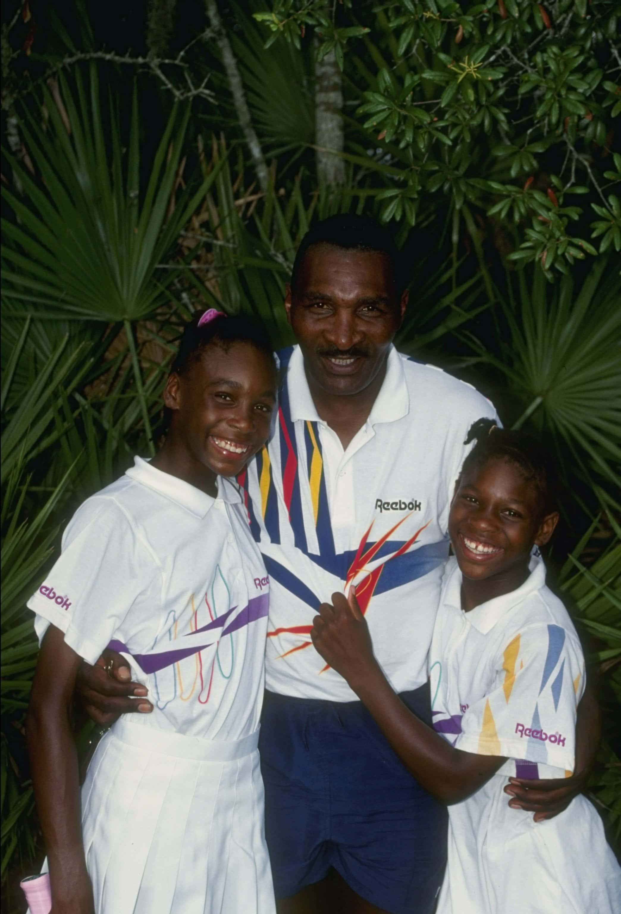 1992:  Serena Williams stands with her sister Venus Williams and father Richard Williams at a tennis camp in Florida. Mandatory Credit: Ken Levine  /Allsport