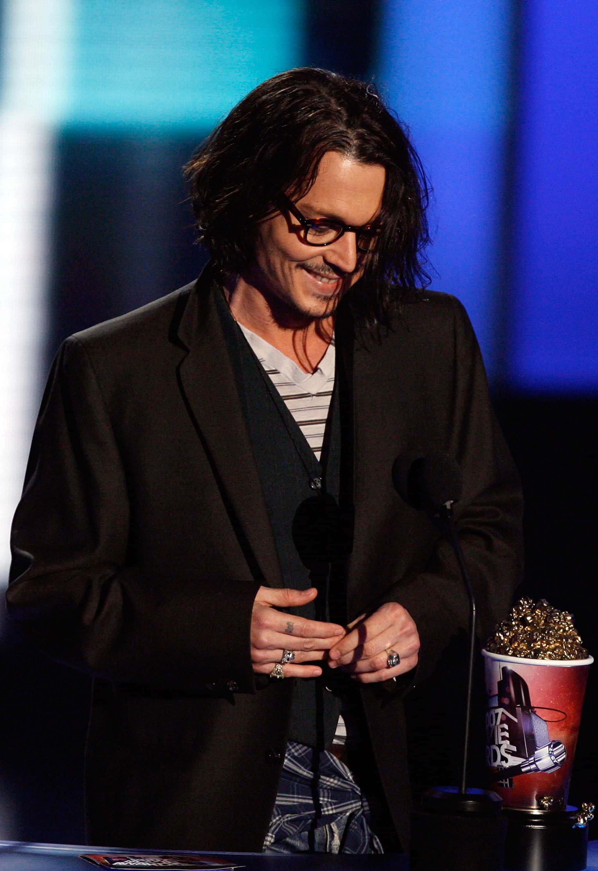 Actor Johnny Depp accepts the award for