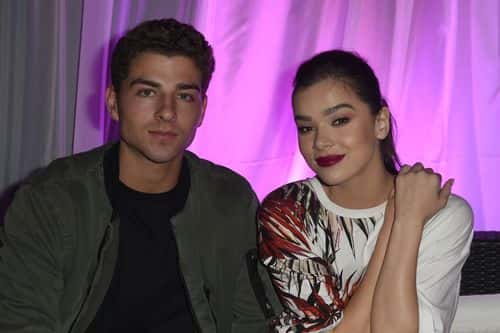 Cameron Smoller (L) and Hailee Steinfeld attend Midnight Garden After Dark at the NYLON Estate on April 14, 2017 in Bermuda Dunes, California.