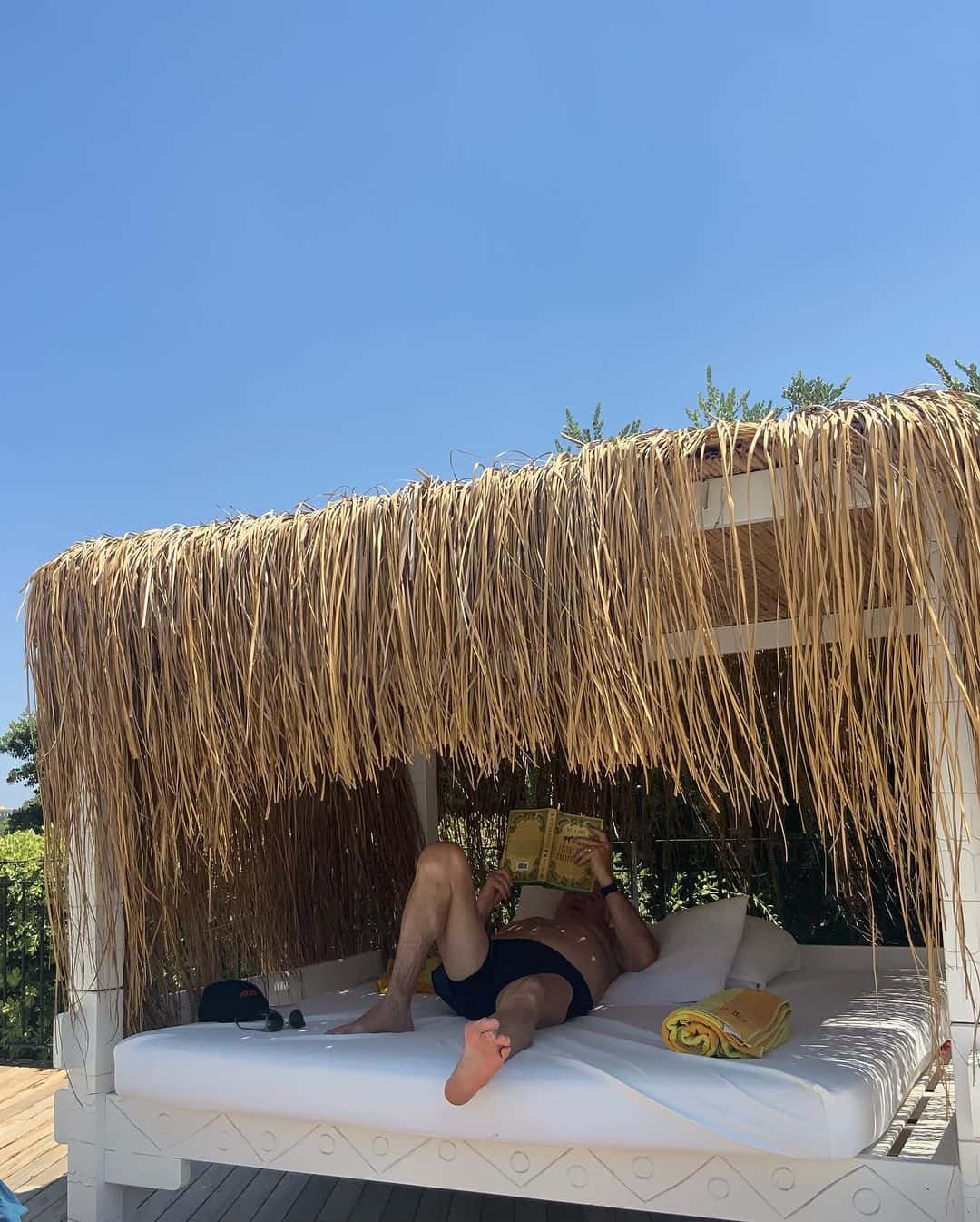 Ana Navarro shared a picture of her husband reading a book that sparked disgust over his feet (Instagram/@ananavarrofl)