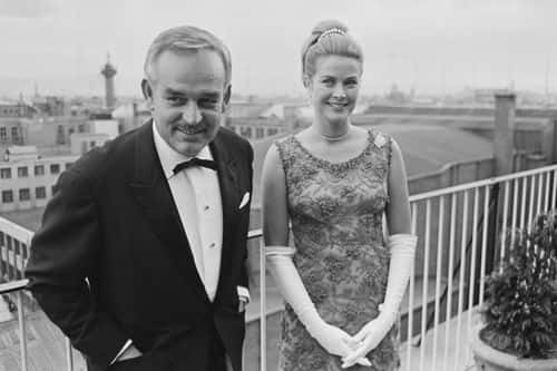 Rainier III, Prince of Monaco (1923-2005) and Princess Grace of Monaco, wearing a dress by Givenchy, attend the Bal Petits Lits Blancs at Powerscourt in Enniskerry, County Wicklow, Ireland, 6th July 1965. (Photo by Philip Townsend/Daily Express/Hulton Archive/Getty Images)