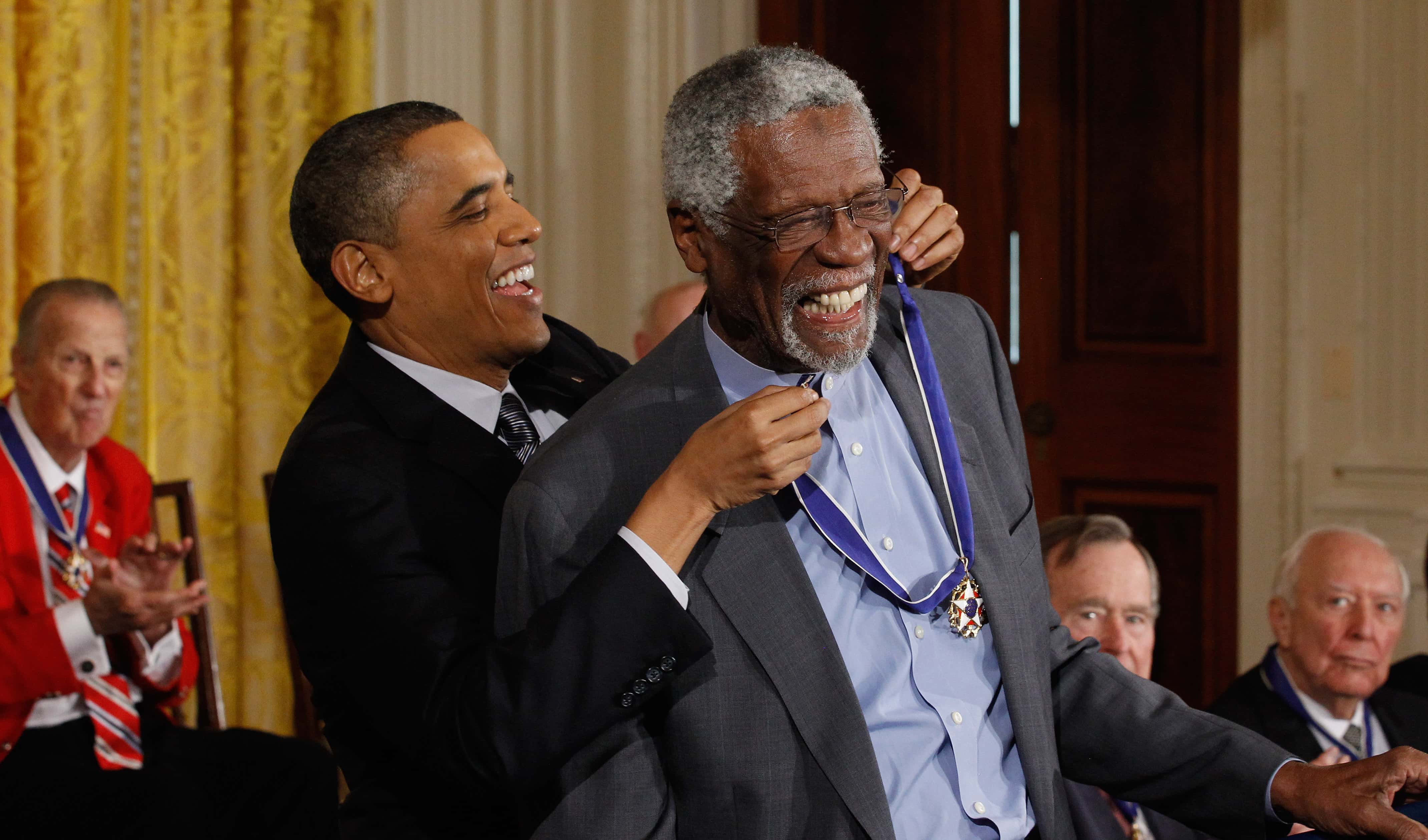 U.S. President Barack Obama (L) presents Basetball Hall of Fame member and human rights advocate Bill Russell the 2010 Medal of Freedom in the East Room of the White House February 15, 2011 in Washington, DC. Obama presented the medal to twelve pioneers in sports, labor, politics and arts.