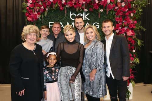 (L-R front) Faye Chrisley, Chloe Chrisley, Savannah Chrisley, Julie Chrisley, Chase Chrisley (L-R Back row) Grayson Chrisley, Todd Chrisley and Nic Kerdiles pose during a personal appearance by Savannah Chrisley at Belk at Cool Springs Galleria Mall on November 05, 2019 in Franklin, Tennessee. (Photo by Terry Wyatt/Getty Images for Rampage )