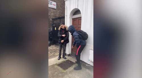 Teens kicking the door in order to make the 'door kick challenge'  video