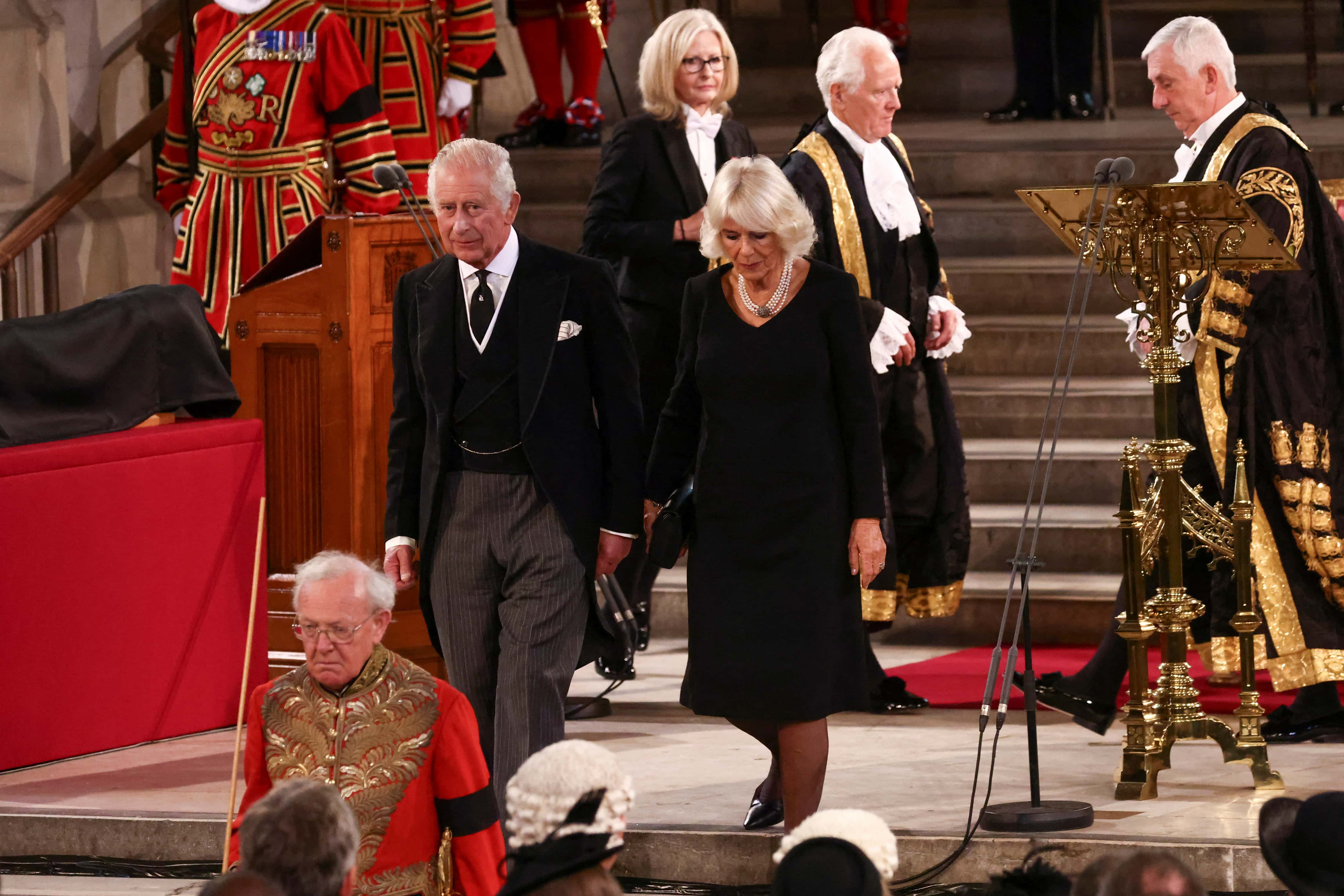 Britain's King Charles III and Britain's Camilla, Queen Consort leave following the presentation of Addresses by both Houses of Parliament in Westminster Hall, inside the Palace of Westminster on September 12, 2022 in London, England. The Lord Speaker and the Speaker of the House of Commons presented an Address to His Majesty on behalf of their respective House in Westminster Hall following the death of Her Majesty Queen Elizabeth II.  The King replied to the Addresses. Queen Elizabeth II died at Balmoral Castle in Scotland on September 8, 2022, and is succeeded by her eldest son, King Charles III.