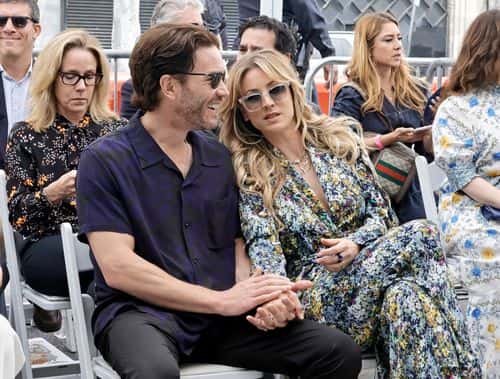 (L-R) Tom Pelphrey and Kaley Cuoco attend as Greg Berlanti is honored with a star on the Hollywood Walk of Fame on May 23, 2022 in Hollywood, California.