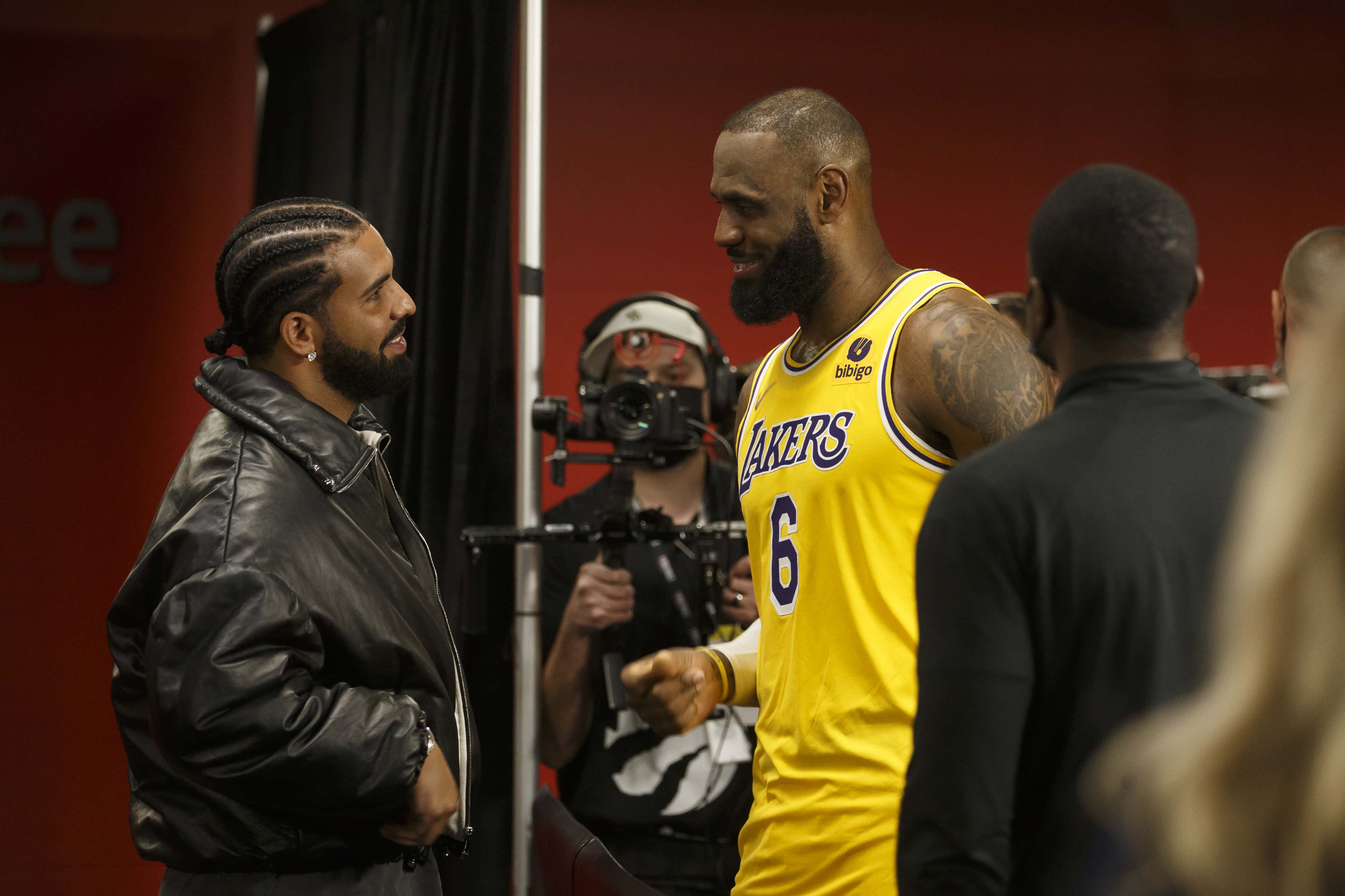 Drake and LeBron James #6 of the Los Angeles Lakers talk after the NBA game between the Toronto Raptors and the Los Angeles Lakers at Scotiabank Arena on March 18, 2022 in Toronto, Canada. NOTE TO USER: User expressly acknowledges and agrees that, by downloading and or using this Photograph, user is consenting to the terms and conditions of the Getty Images License Agreement.