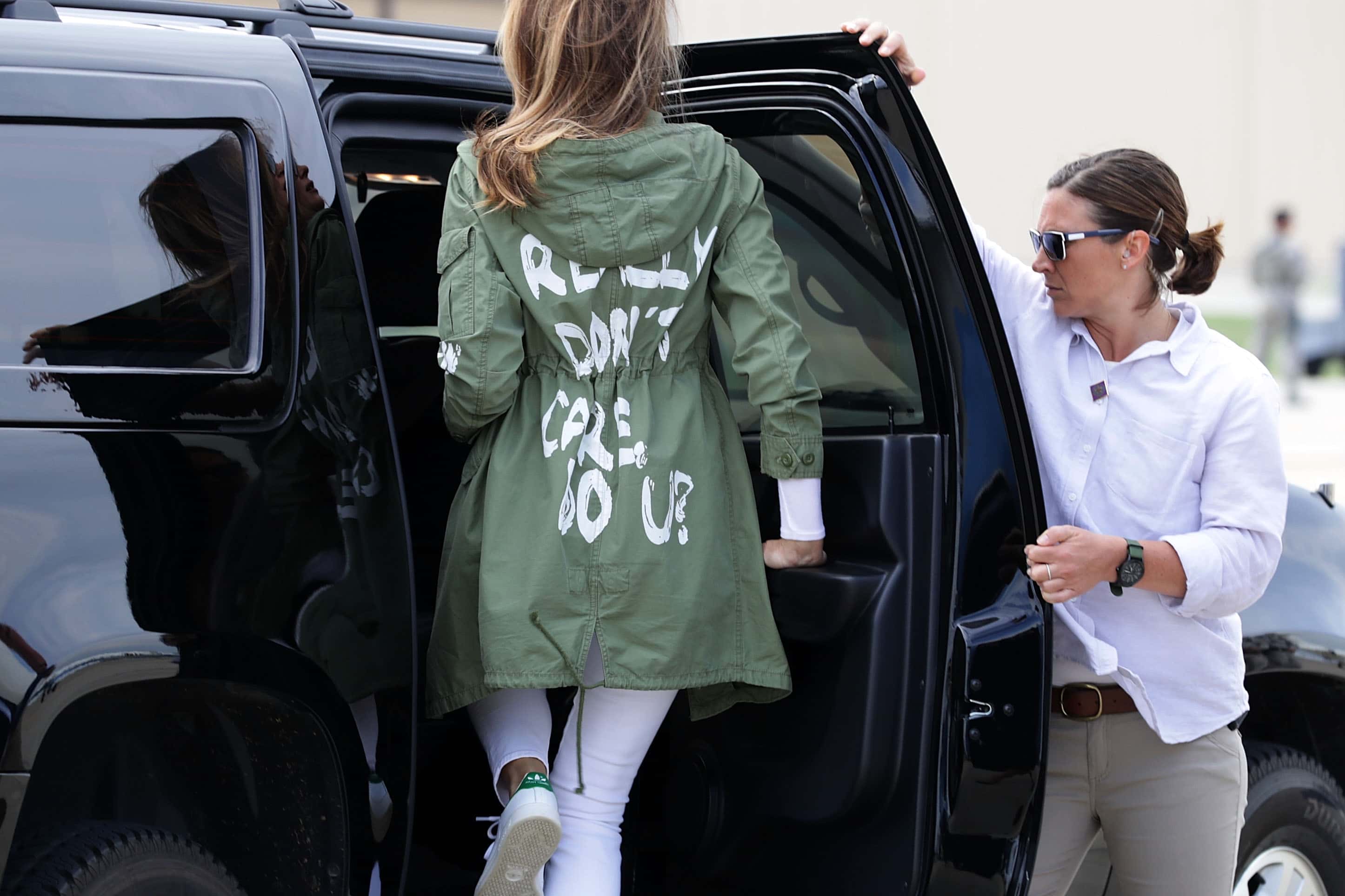 U.S. first lady Melania Trump (C) climbs back into her motorcade after traveling to Texas to visit facilities that house and care for children taken from their parents at the U.S.-Mexico border June 21, 2018 at Joint Base Andrews, Maryland. (Photo by Chip Somodevilla/Getty Images)