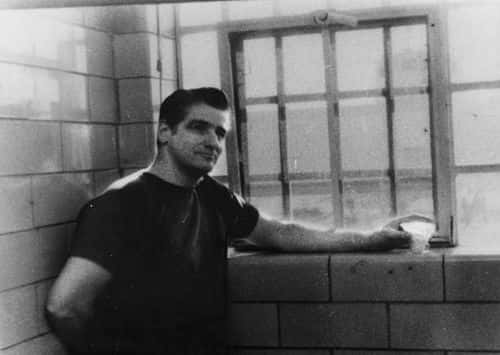 Self-confessed Boston Strangler Albert DeSalvo stands in jail (Getty Images)