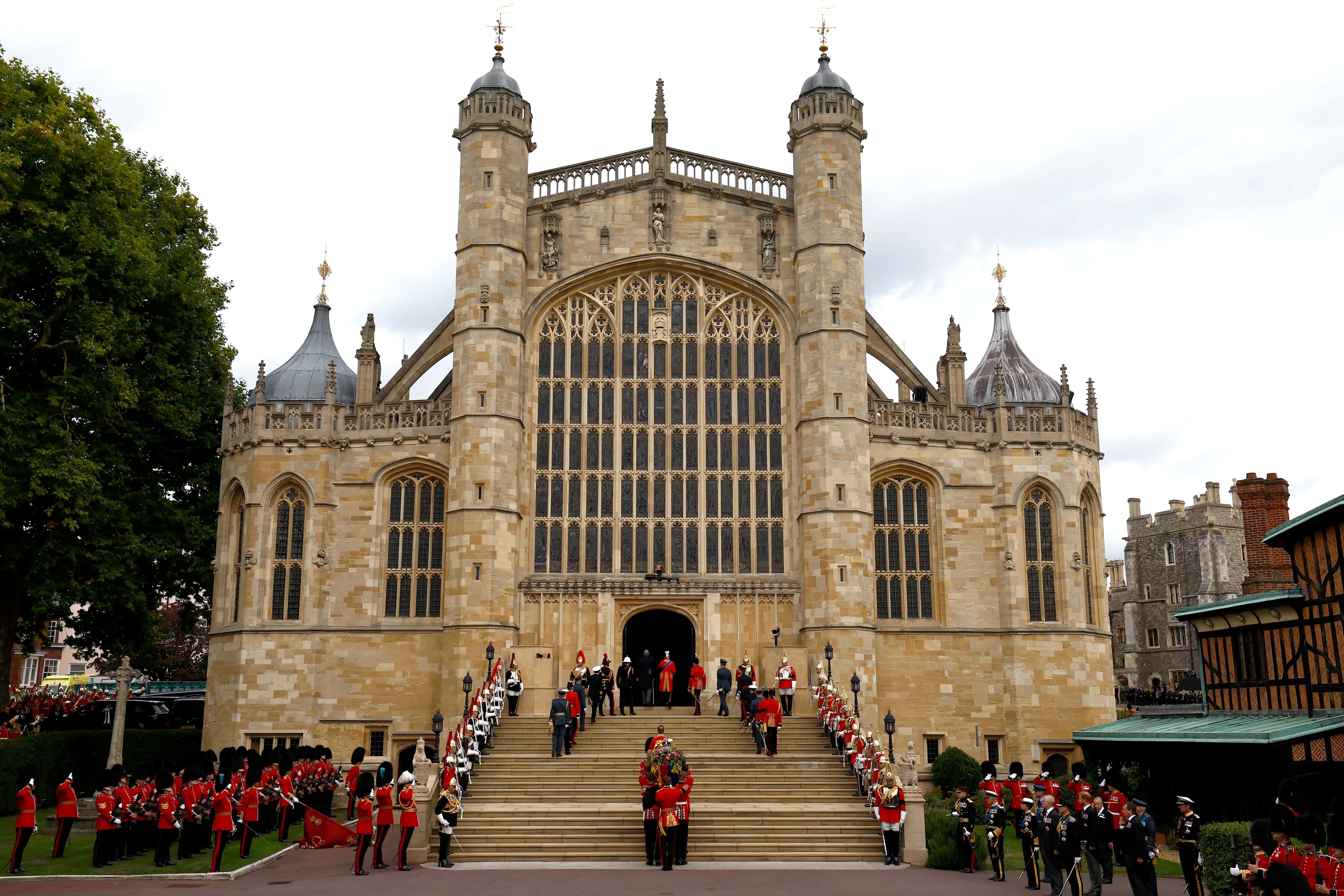 Pall bearers carry the coffin of Queen Elizabeth II with the Imperial State Crown resting on top into St. George's Chapel on September 19, 2022 in Windsor, England. The committal service at St George's Chapel, Windsor Castle, took place following the state funeral at Westminster Abbey. A private burial in The King George VI Memorial Chapel followed. Queen Elizabeth II died at Balmoral Castle in Scotland on September 8, 2022, and is succeeded by her eldest son, King Charles III.