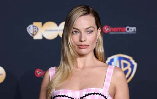 Margot Robbie poses for photos as she promotes the upcoming film 
