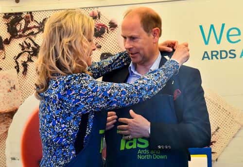 Sophie, Countess of Wessex helps Prince Edward, Earl of Wessex, to put on a cooking apron while attending celebrations marking the Platinum Jubilee of Britain's Queen Elizabeth on June 4, 2022 in Bangor, United Kingdom. The Platinum Jubilee of Elizabeth II is being celebrated from June 2 to June 5, 2022, in the UK and Commonwealth to mark the 70th anniversary of the accession of Queen Elizabeth II on 6 February 1952. (Photo by Clodagh Kilcoyne - WPA Pool/Getty Images)