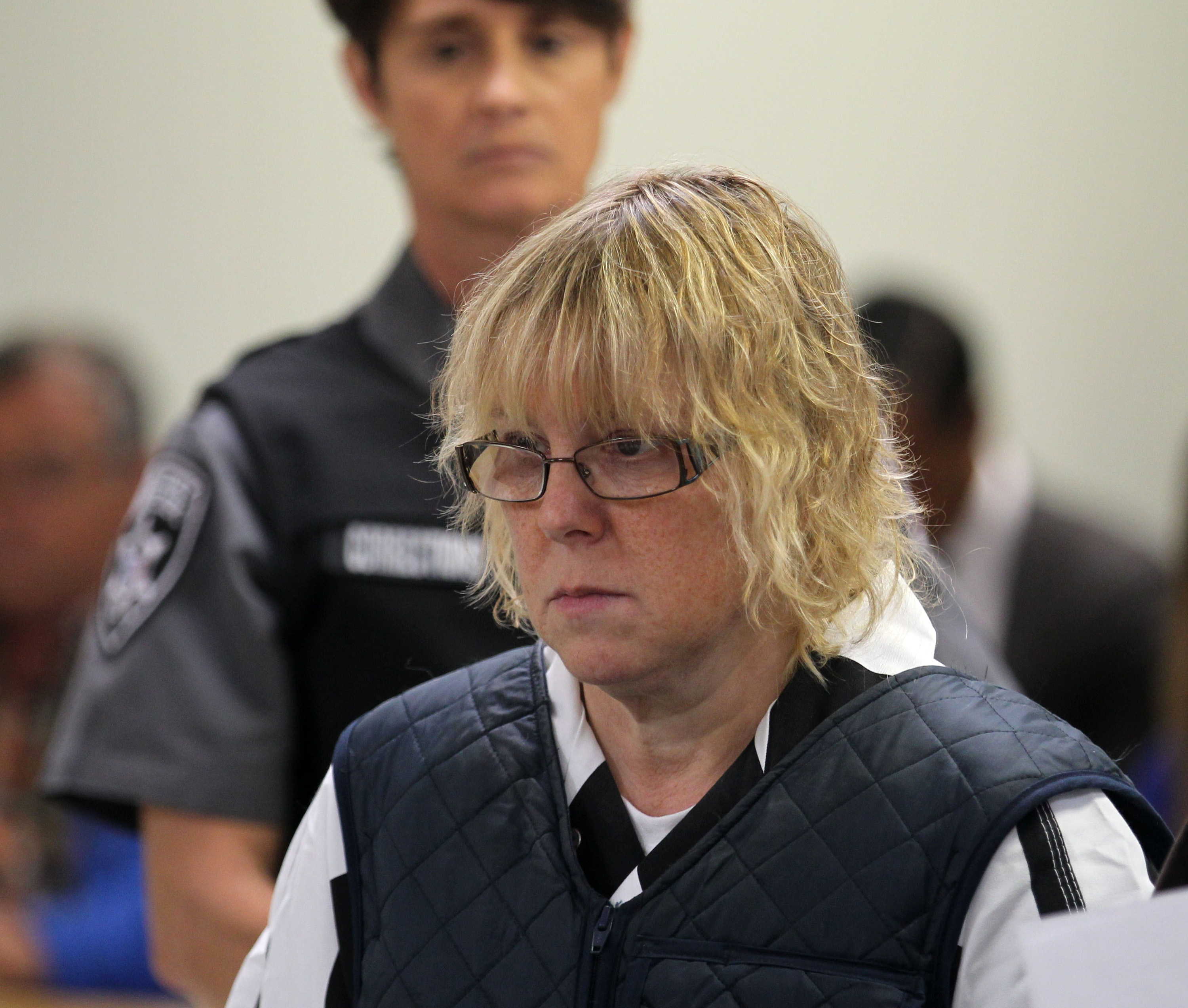 Joyce Mitchell (L) appears before Judge Buck Rogers in Plattsburgh City Court on June 15, 2015 in Plattsburgh, New York. Mitchell allegedly aided inmates Richard Matt and David Sweat in their escape from Clinton Correctional Facility. They were discovered missing the morning of June 6.
