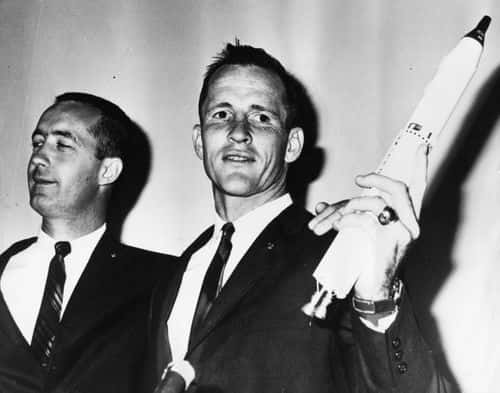 American astronauts James A McDivitt (left) and Edward H White (holding a model of their rocket) arriving for an after show after returning home safely from their Gemini 4 space flight, Paris, 1965. (Photo by Keystone/Hulton Archive/Getty Images)