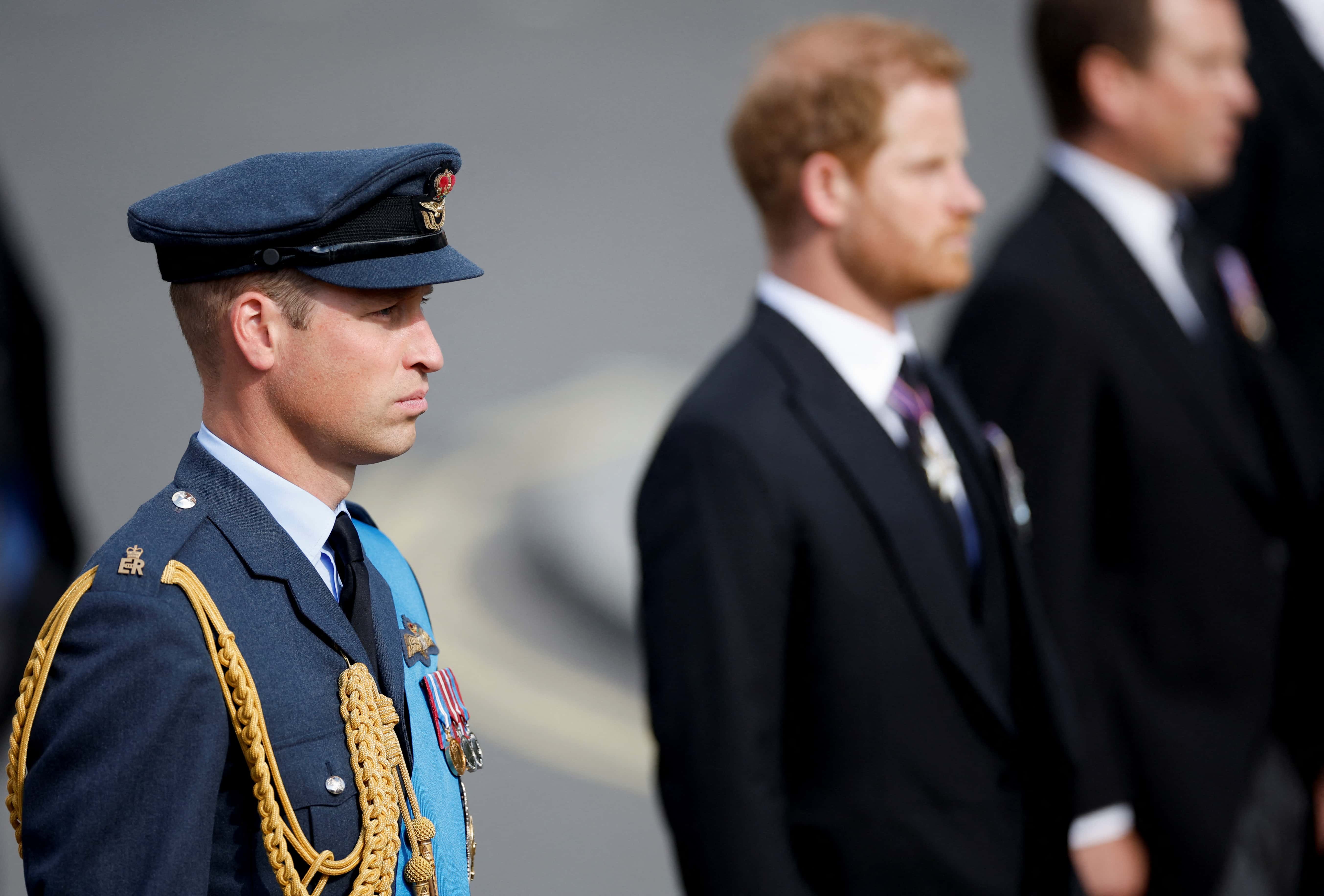 Prince William, Prince of Wales and Prince Harry march during the procession of the coffin of Queen Elizabeth II from Buckingham Palace to the Houses of Parliament for her lying in state in Westminster Hall on September 14, 2022 in London, United Kingdom. Queen Elizabeth II's coffin is taken in procession on a Gun Carriage of The King's Troop Royal Horse Artillery from Buckingham Palace to Westminster Hall where she will lay in state until the early morning of her funeral. Queen Elizabeth II died at Balmoral Castle in Scotland on September 8, 2022, and is succeeded by her eldest son, King Charles III.