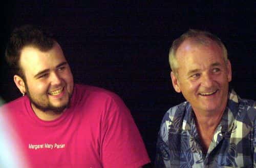 Actor Bill Murray (R) and his son Homer Murray pause to have their picture taken as they arrive for the Free Arts for Abused Children's 3rd annual Art Auction benefit July 17, 2002 in New York City. The event auctions off the images created by artists and celebrities to raise funds for the nonprofit outreach program for abused kids.