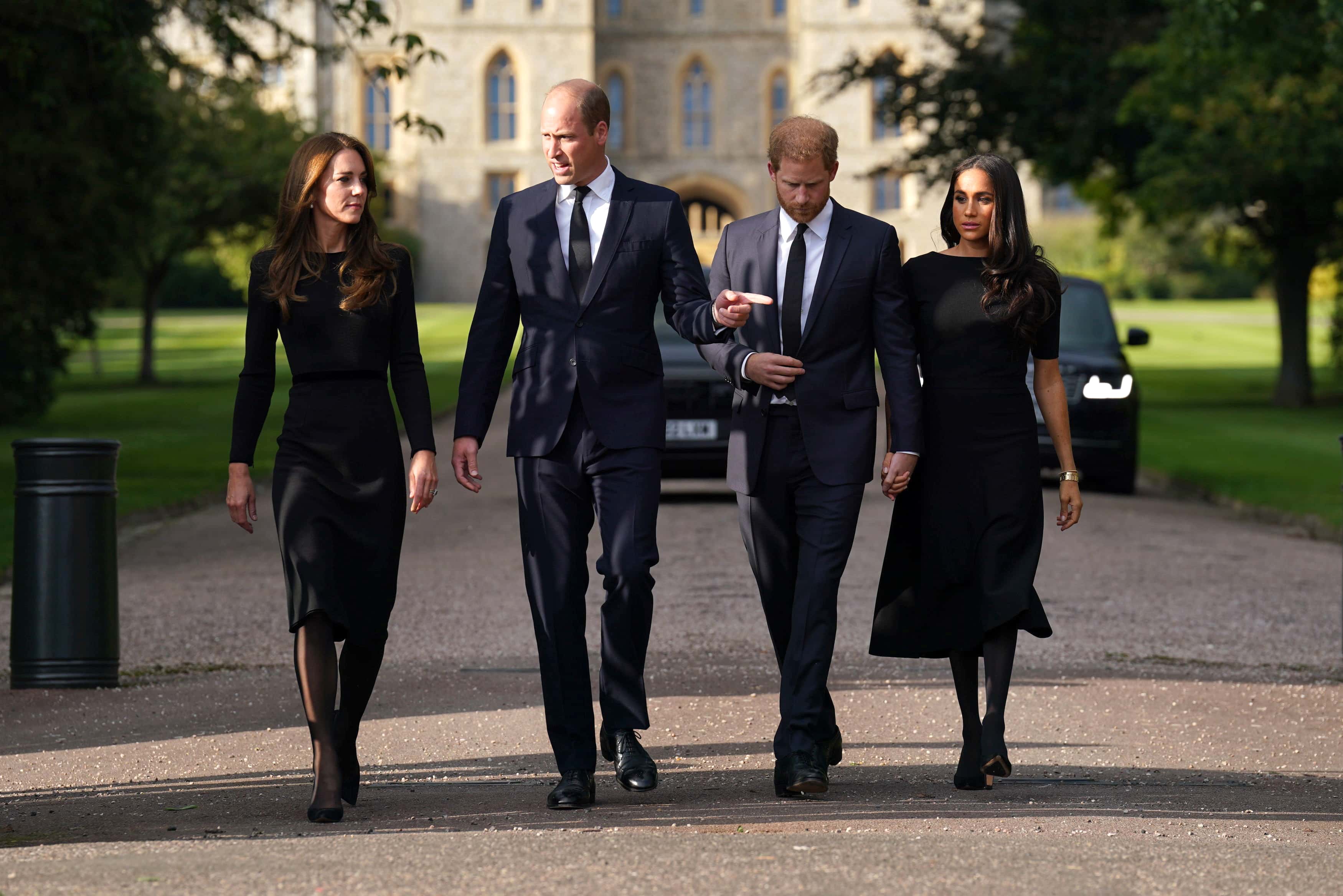 Catherine, Princess of Wales, Prince William, Prince of Wales, Prince Harry, Duke of Sussex, and Meghan, Duchess of Sussex on the long Walk at Windsor Castle on September 10, 2022 in Windsor, England. Crowds have gathered and tributes left at the gates of Windsor Castle to Queen Elizabeth II, who died at Balmoral Castle on 8 September, 2022. (Photo by Kirsty O'Connor - WPA Pool/Getty Images)