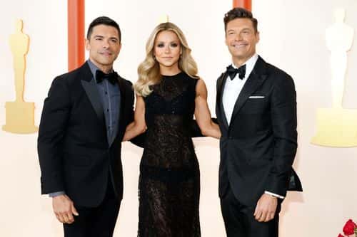 (L-R) Mark Consuelos, Kelly Ripa, and Ryan Seacrest attend the 95th Annual Academy Awards on March 12, 2023 in Hollywood, California.