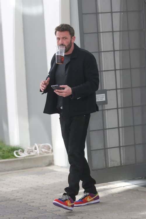 Ben Affleck on his way to a meeting with a large coffee. (Backgrid)