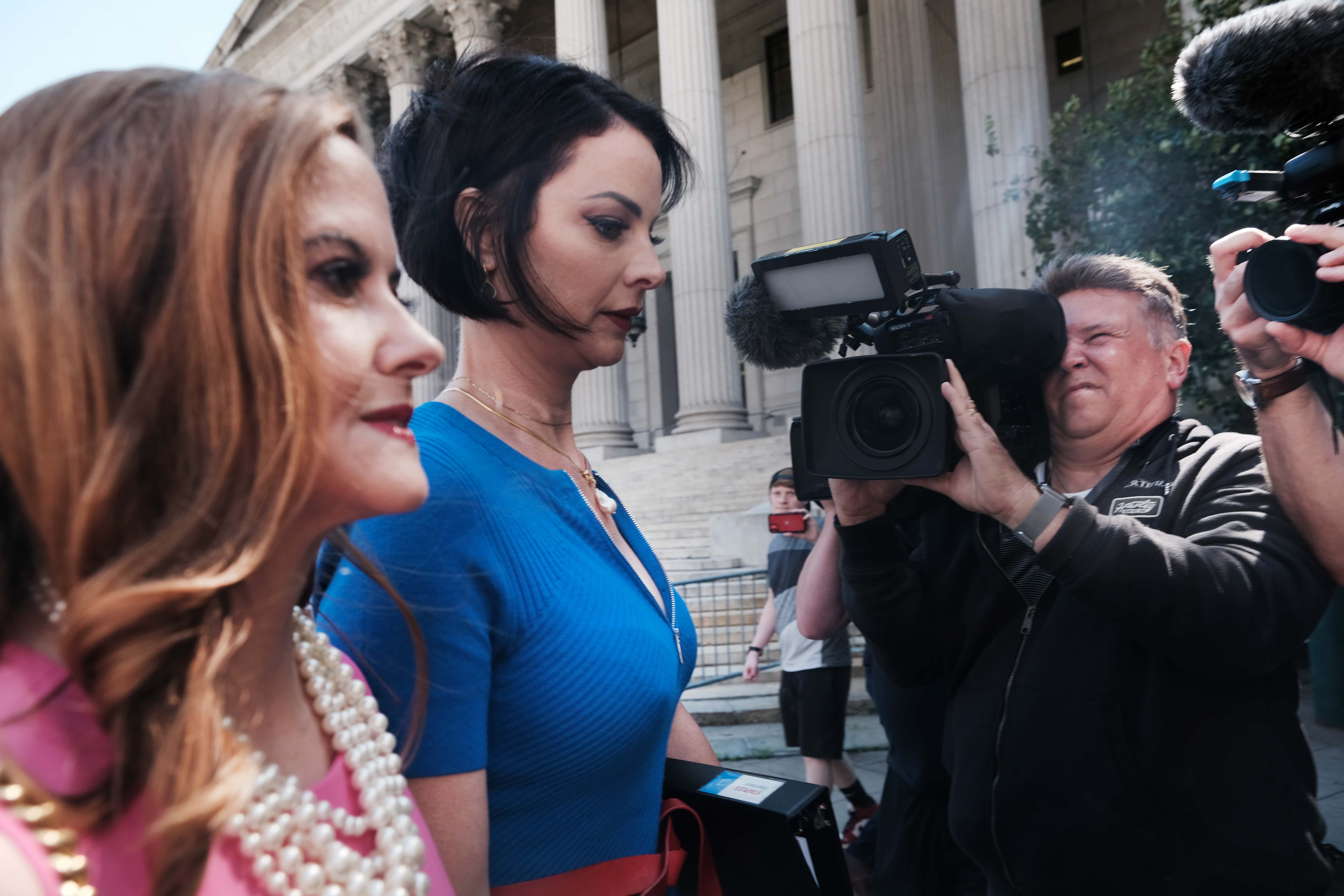 Jeffrey Epstein's alleged victims Sarah Ransome (C) and Elizabeth Stein (L) arrive at Manhattan Federal court for the sentencing of former socialite Ghislaine Maxwell on June 28, 2022 in New York City. Ghislaine Maxwell was found guilty on five of six criminal counts and faces decades in prison for her involvement with alleged child sex trafficker Jeffrey Epstein.
