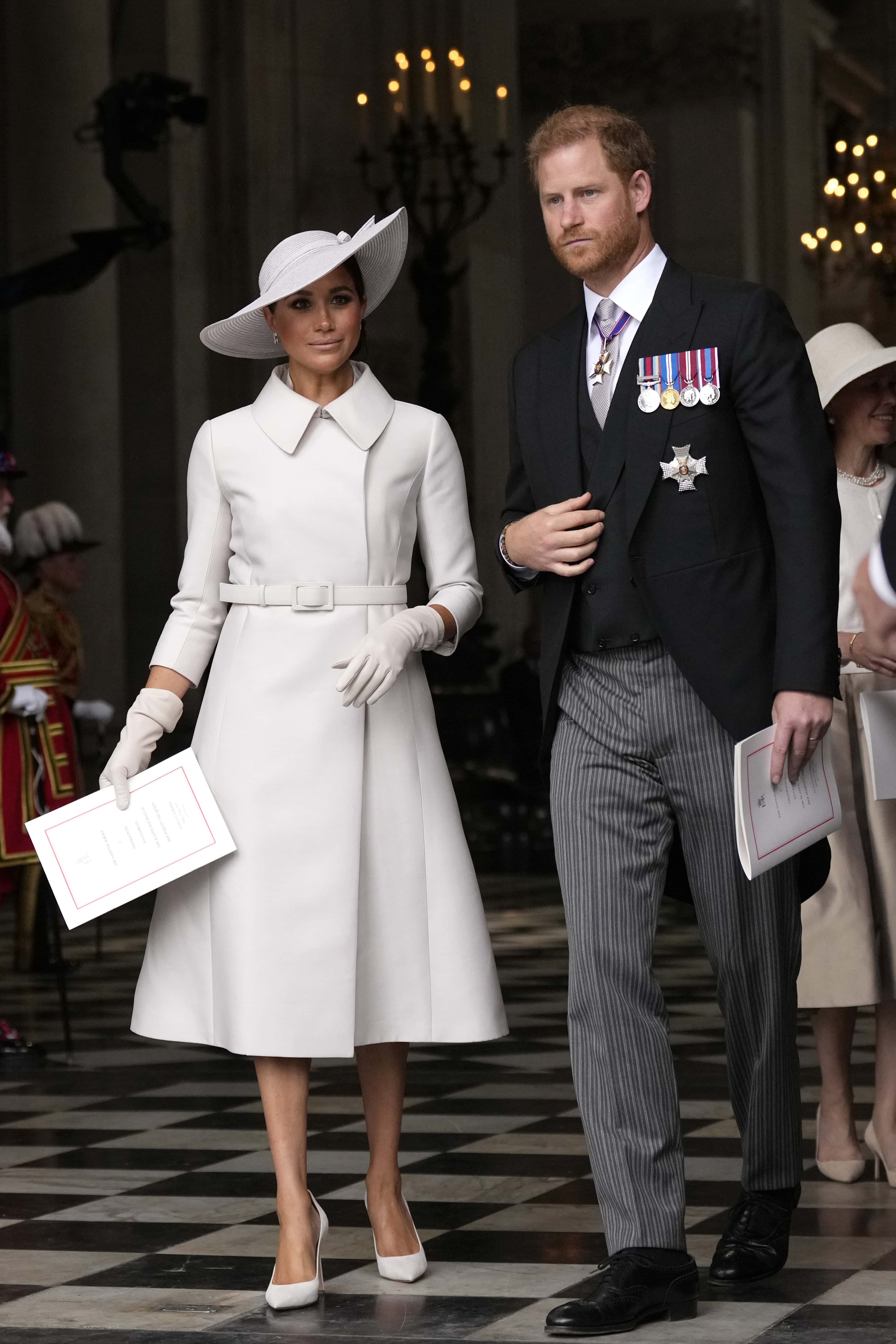Prince Harry and Meghan Markle, Duke and Duchess of Sussex leave after a service of thanksgiving for the reign of Queen Elizabeth II at St Paul's Cathedral in London, Friday, June 3, 2022 on the second of four days of celebrations to mark the Platinum Jubilee. The events over a long holiday weekend in the U.K. are meant to celebrate the monarch's 70 years of service.