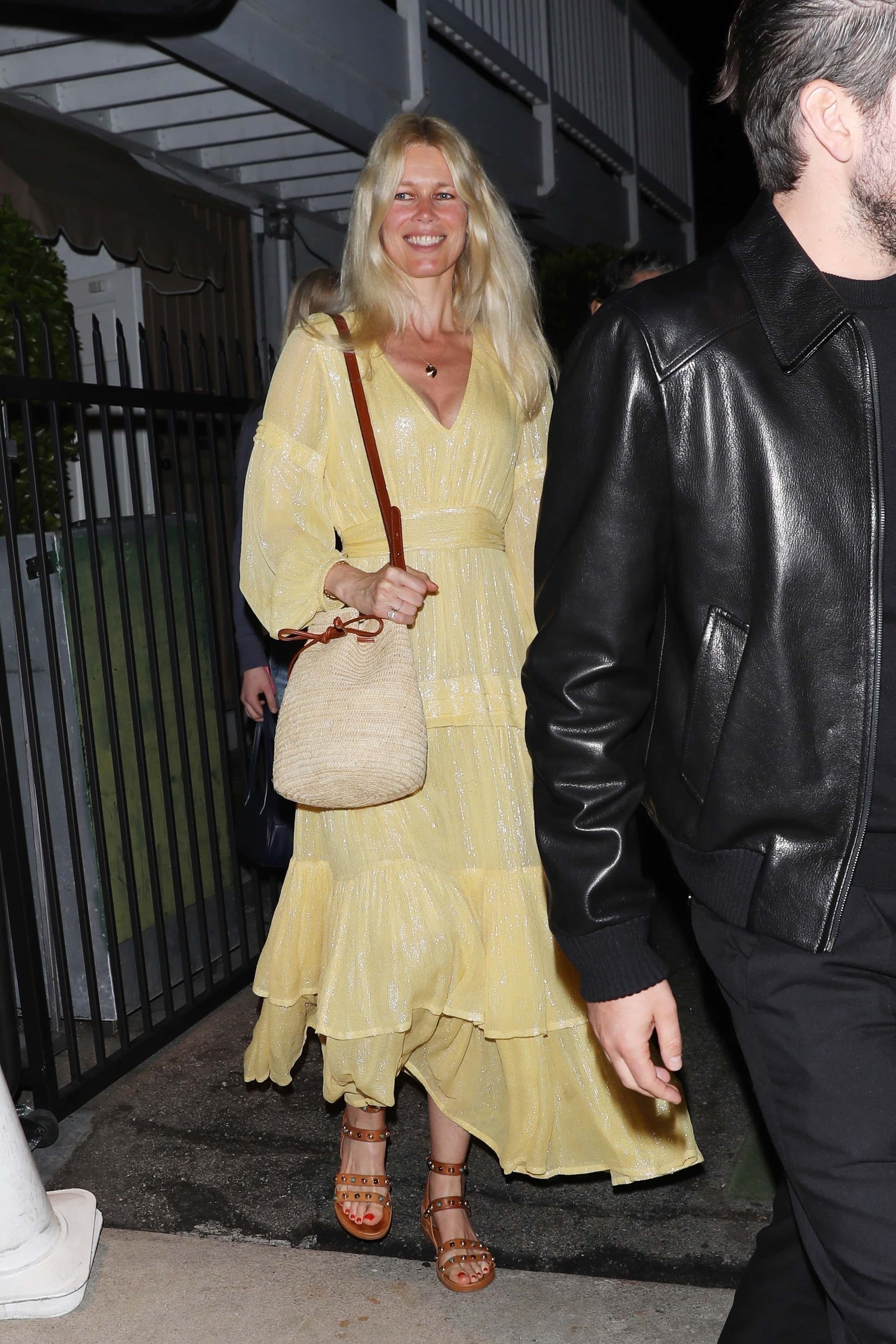 The supermodel put on an elegant display in a pastel yellow bohemian-inspired maxi dress  (backgrid)