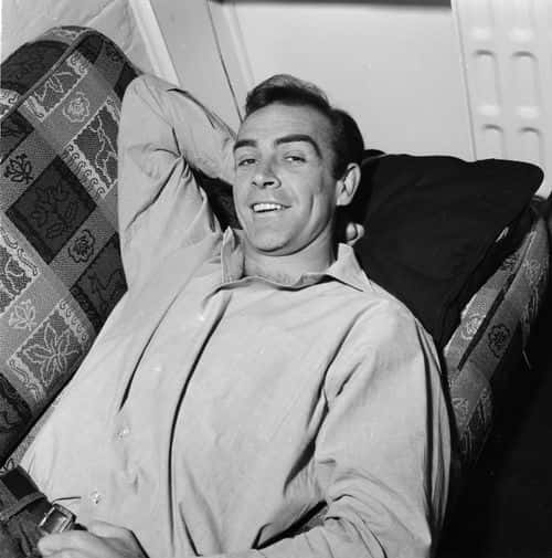 Scottish actor Sean Connery, the new face of superspy James Bond, relaxes in his basement flat in London's NW8.