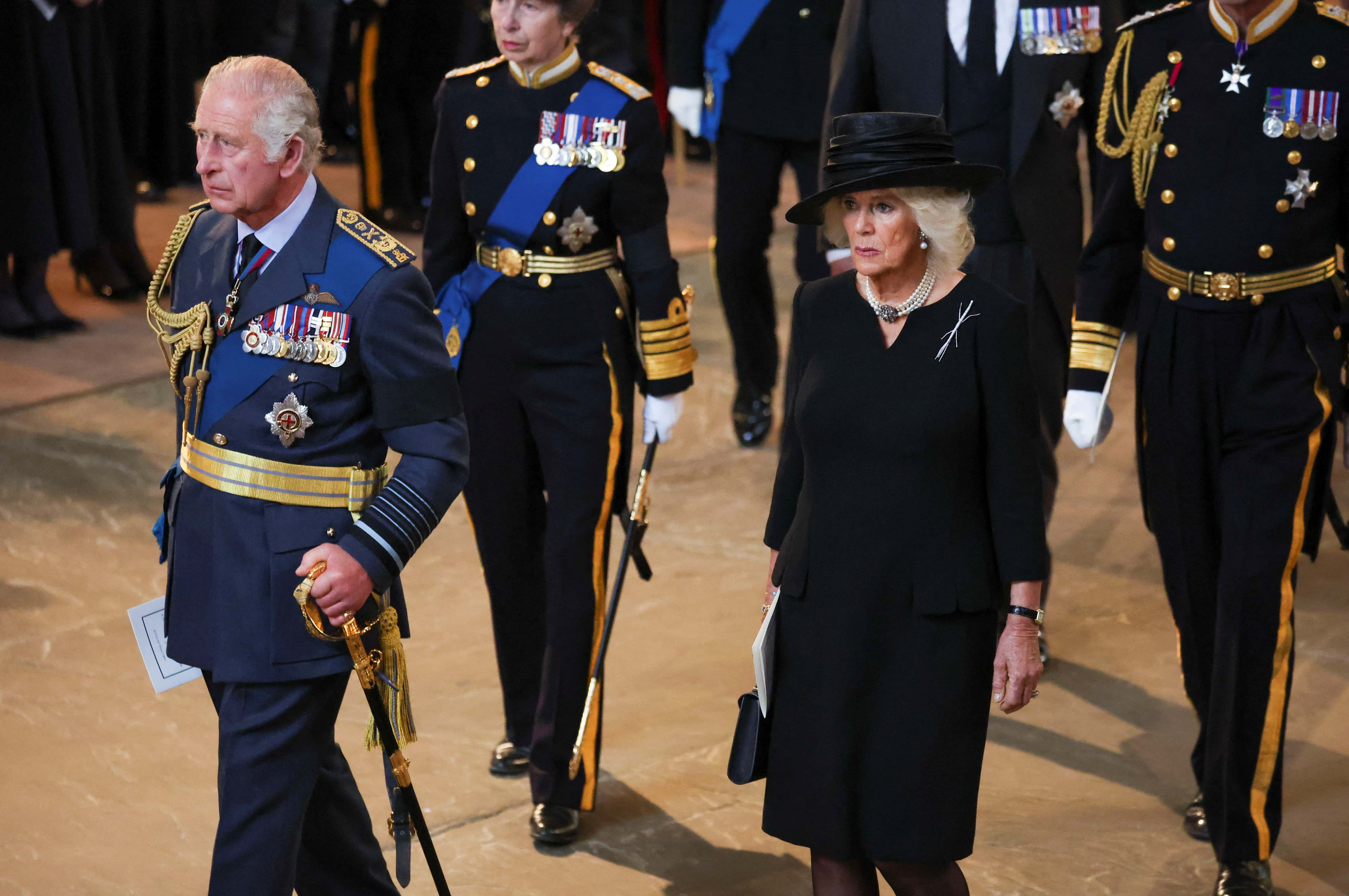 King Charles III and Camilla, Queen Consort walk as procession with the coffin of Britain's Queen Elizabeth arrives at Westminster Hall from Buckingham Palace for her lying in state, on September 14, 2022 in London, United Kingdom. Queen Elizabeth II's coffin is taken in procession on a Gun Carriage of The King's Troop Royal Horse Artillery from Buckingham Palace to Westminster Hall where she will lay in state until the early morning of her funeral. Queen Elizabeth II died at Balmoral Castle in Scotland on September 8, 2022, and is succeeded by her eldest son, King Charles III.