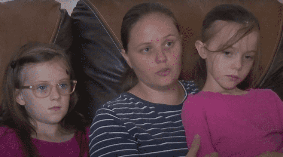 She might have been killed if she had not moved from the middle seat to the back seat to lie down, according to her mother (