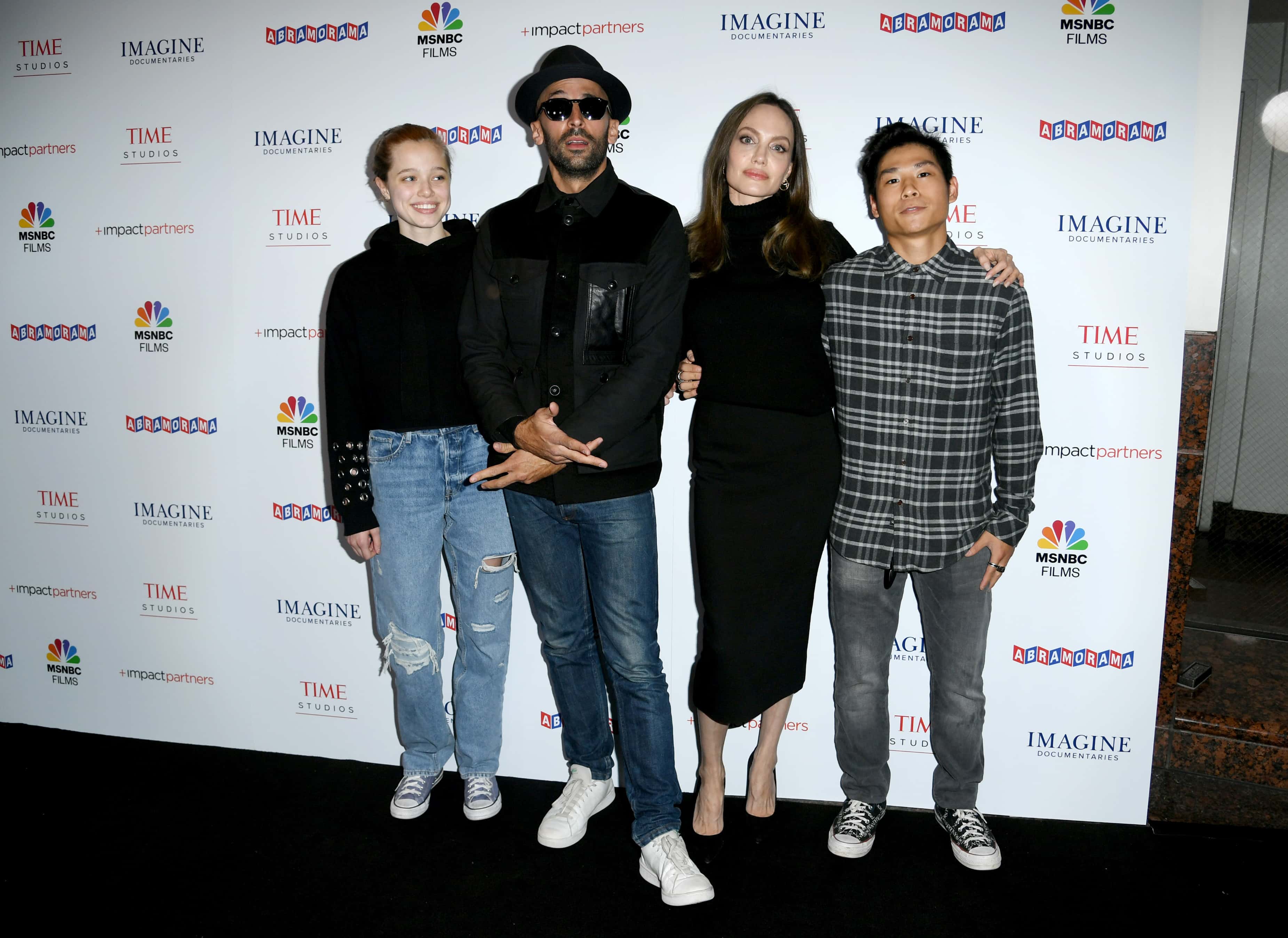 (L-R) Shiloh Jolie-Pitt, street artist JR, actress Angelina Jolie and Pax Thien Jolie-Pitt attend the Los Angeles premiere of MSNBC Films'