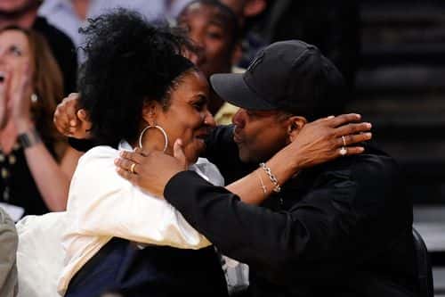 Actor Denzel Washington and wife Pauletta Pearson kiss for the 'Kiss Cam' during Game One of the Western Conference Finals during the 2009 NBA Playoffs between the Los Angeles Lakers and the Denver Nuggets at Staples Center on May 19, 2009 in Los Angeles, California. NOTE TO USER: User expressly acknowledges and agrees that, by downloading and or using this photograph, User is consenting to the terms and conditions of the Getty Images License Agreement.