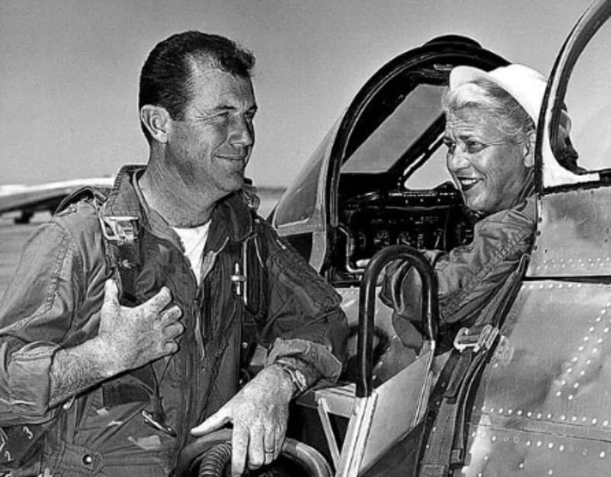 Jacqueline Cochran in the F-86 she piloted in 1953 when she became the first woman to break the sound barrier. She is talking with Chuck Yeager, who, in 1947, became the first man to fly faster than the speed of sound.
(Air Force Flight Test Center History Office/Air Force Link via Wikipedia)
