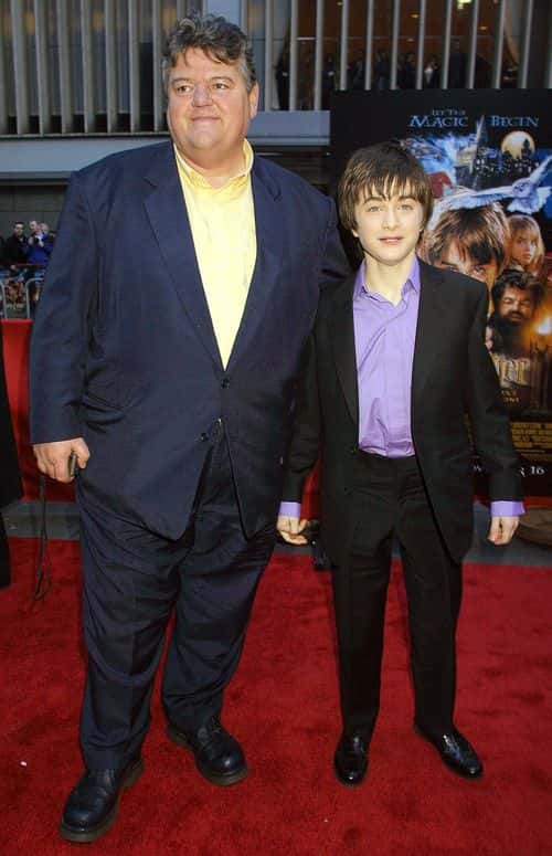 Actor Daniel Radcliffe (R) and Actor Robbie Coltrane attend the premiere of