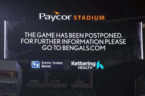 An announcement is displayed on the scoreboard as the game between the Cincinnati Bengals and the Buffalo Bills is postponed following the injury of Damar Hamlin #3 of the Buffalo Bills during the first quarter at Paycor Stadium on January 02, 2023 in Cincinnati, Ohio.
