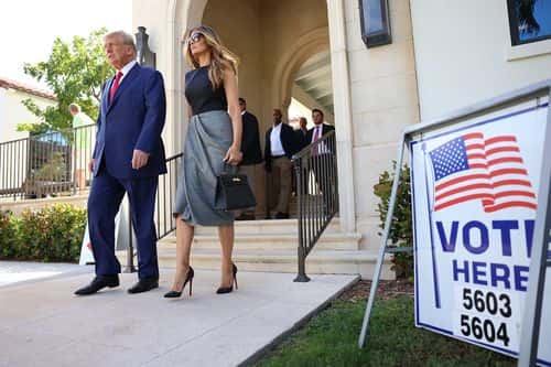 Former U.S. President Donald Trump and former first lady Melania Trump walk together after voting at a polling station setup in the Morton and Barbara Mandel Recreation Center on November 08, 2022 in Palm Beach, Florida. After months of candidates campaigning, Americans are voting in the midterm elections to decide close races across the nation.