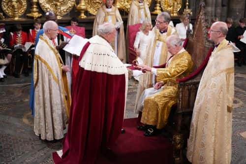 Lord Carrington, Lord Great Chamberlain, presents the Spurs to King Charles III during his coronation ceremony in Westminster Abbey on May 6, 2023 in London, England. The Coronation of Charles III and his wife, Camilla, as King and Queen of the United Kingdom of Great Britain and Northern Ireland, and the other Commonwealth realms takes place at Westminster Abbey today. Charles acceded to the throne on 8 September 2022, upon the death of his mother, Elizabeth II.
