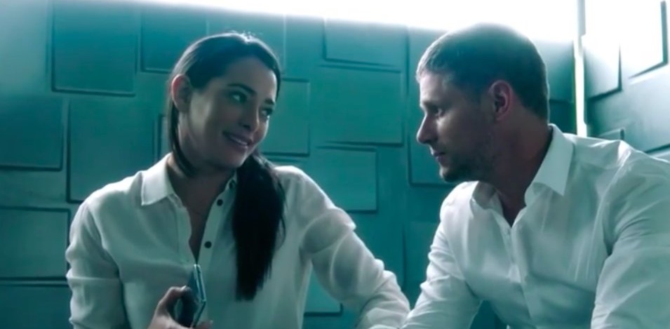 Natalie Martinez (L) and Matt Lauria (R) play the roles of the two office colleagues who get into the elevator after a long day at work. Source: Hulu