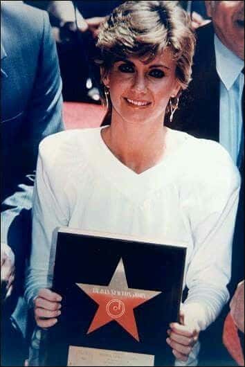 Olivia Newton with her star. (Photo via Facebook)