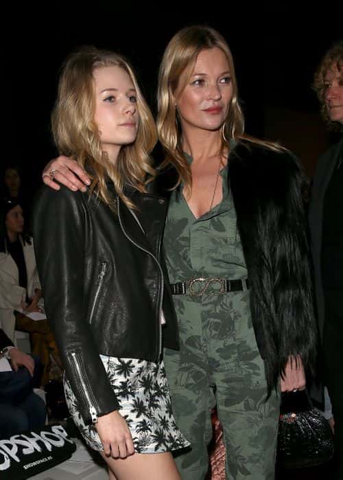Kate Moss and sister Lottie Moss attends the Topshop Unique show at London Fashion Week AW14 at Tate Modern on February 16, 2014 in London, England