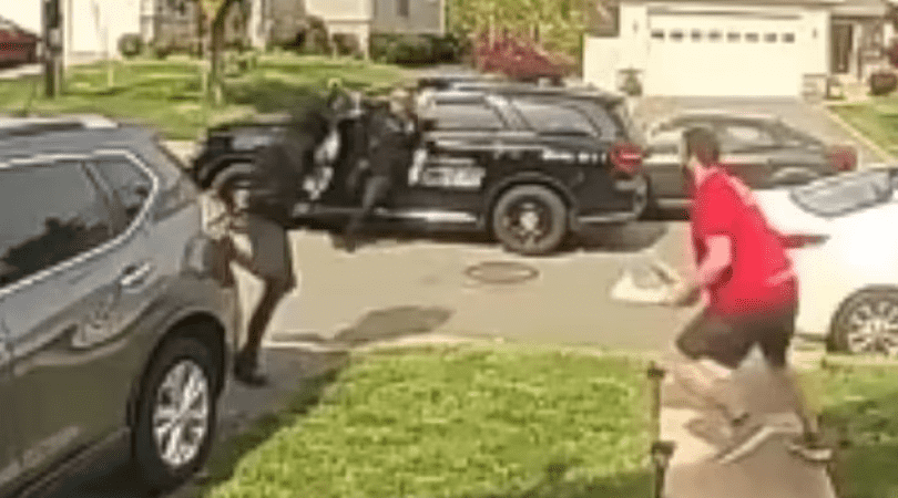 One of the suspects remains in the car, but the other attempts to flee on foot before encountering Tyler Morrell (coccosaston/Instagram)