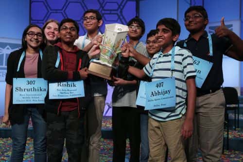 Co-champions (L-R) Shruthika Padhy (307) of Cherry Hill, New Jersey, Erin Howard (93) of Huntsville, Alabama, Rishik Gandhasri (5) of San Jose, California, Christopher Serrao (427) of Whitehouse Station, New Jersey, Saketh Sundar (132) of Clarksville, Maryland, Sohum Sukhatankar (354) of Dallas, Texas, Abhijay Kodali (407) of Flower Mound, Texas, and Rohan Raja (462) of Irving, Texas, hold the trophy for photographers after 20 rounds of competition and won the championship of the Scripps National Spelling Bee at the Gaylord National Resort & Convention Center May 31, 2019 in National Harbor, Maryland. The winning spellers made history with the most number of co-champions in the spelling event history.