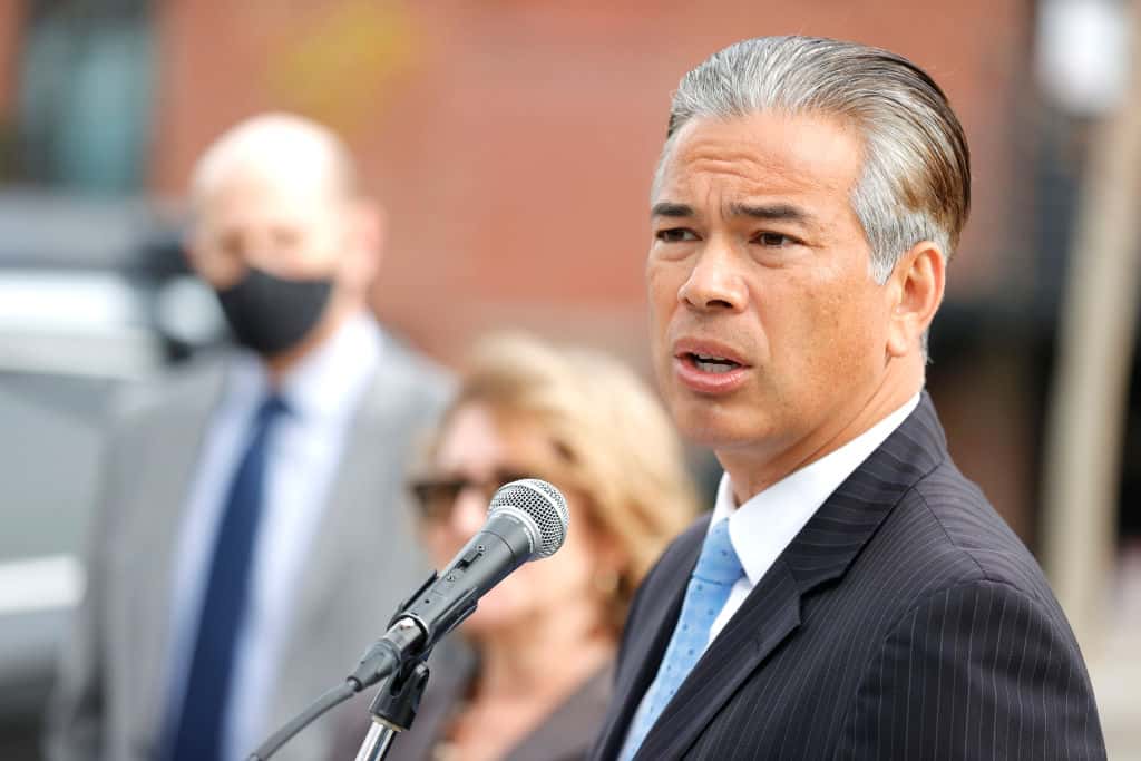 SAN FRANCISCO, CALIFORNIA - NOVEMBER 15: California Attorney General Rob Bonta speaks during a news conference outside of an Amazon distribution facility on November 15, 2021 in San Francisco, California. Bonta announced that Amazon Inc. will have to pay a $500,000 fine after the company failed to adequately notify workers and officials about coronavirus cases at its facilities pursuant to California Assembly Bill 865. The bill also requires companies to share COVID-19 safety plans, benefits and protections with employees. (Photo by Justin Sullivan/Getty Images)
