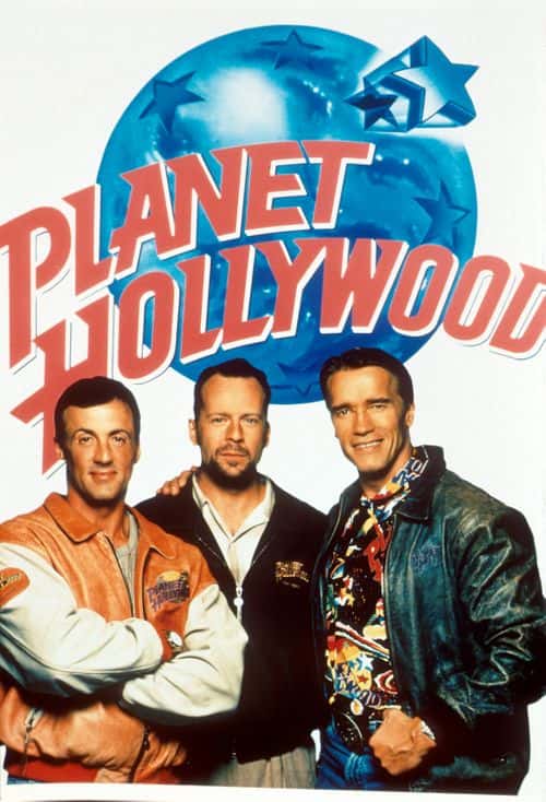 Bruce Willis, Sylvester Stallone and Arnold Schwarzenegger pose with a 