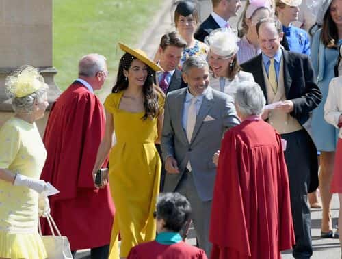 George and Amal Clooney attend the wedding of Prince Harry to Ms Meghan Markle at St George's Chapel, Windsor Castle on May 19, 2018 in Windsor, England. Prince Henry Charles Albert David of Wales marries Ms. Meghan Markle in a service at St George's Chapel inside the grounds of Windsor Castle. Among the guests were 2200 members of the public, the royal family and Ms. Markle's Mother Doria Ragland.